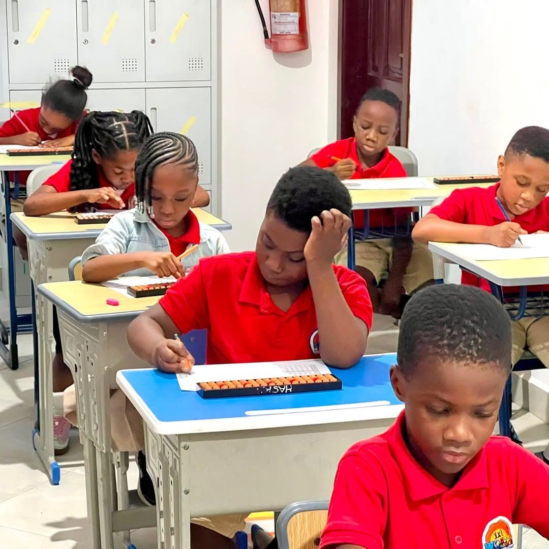 Learners practising abacus in class